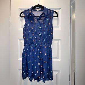 BCBGeneration romper with vibrant pattern and fishnet design NWOT